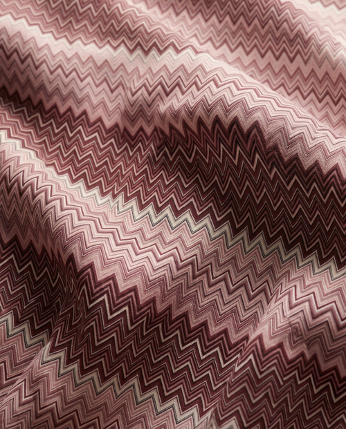 Amalfi Burgundy chevron print in motion — flowing fabric close-up in burgundy and blush