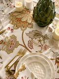 Heritage Bloom Green tablecloth styled with plates, candles and artichoke centerpiece, high-angle view