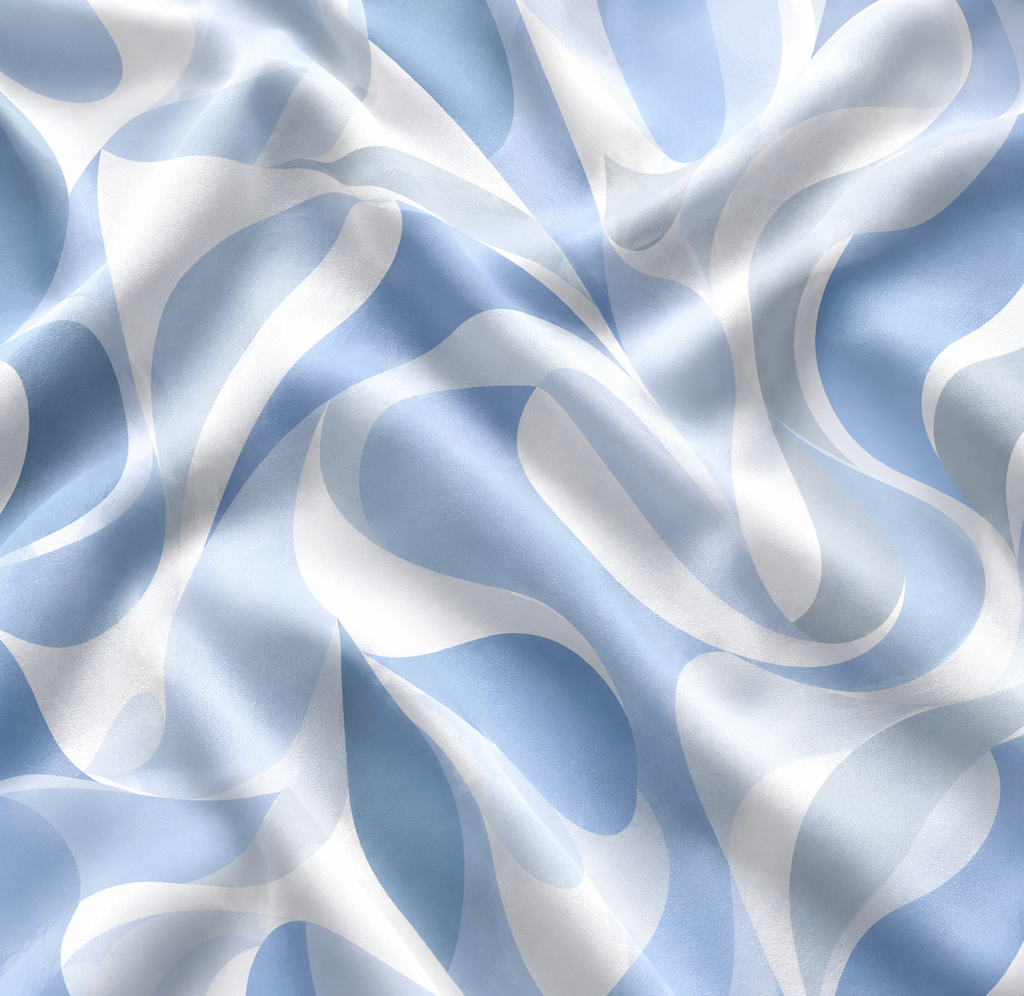 Riviera Blue tablecloth fabric close-up showing abstract wave pattern in sky blue and white