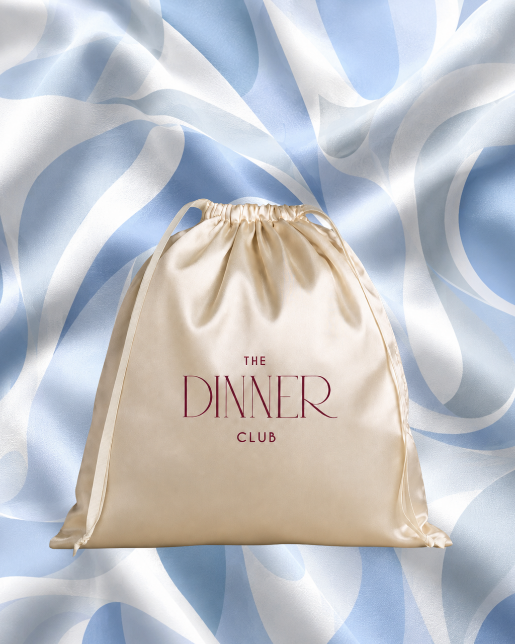 Riviera Blue fabric swatch — abstract wave pattern in sky blue and white